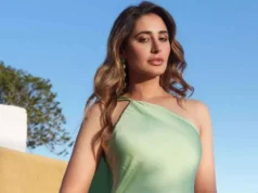 At Shalini Passi’s star-studded MASH Ball, Nargis Fakhri dazzles in a stylish white gown. Nargis Fakhri shines in a chic white gown at Shalini Passi's star-studded MASH Ball.